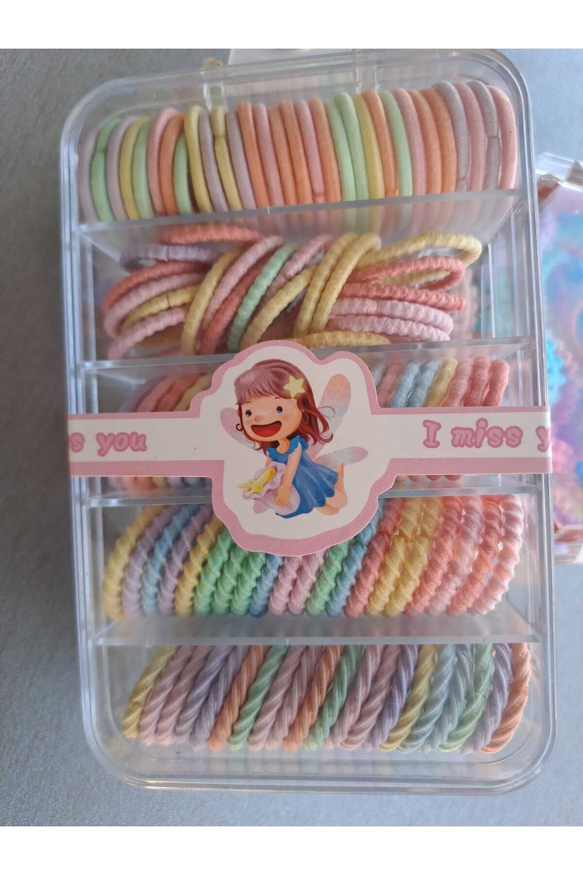 DÜZ TIRTIKLI VE KIVRIL MODEL KARIŞIK SOFT RENK LASTİK TOKA (KÜÇÜK BOY)